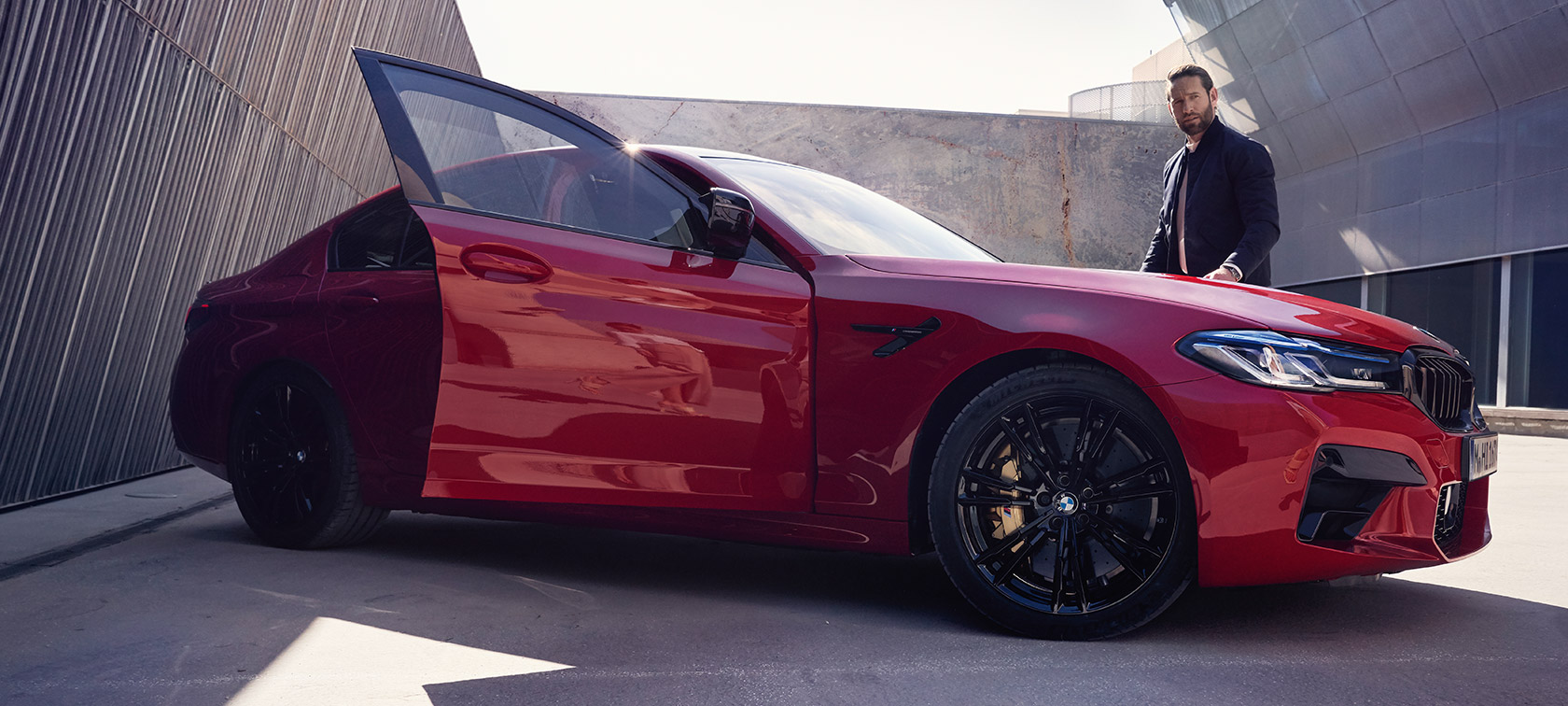 BMW M5 Competition F90 LCI Facelift 2020 side view with open door BMW M5 Competition F90 LCI Facelift 2020 BMW Individual Imola Red side view with open door