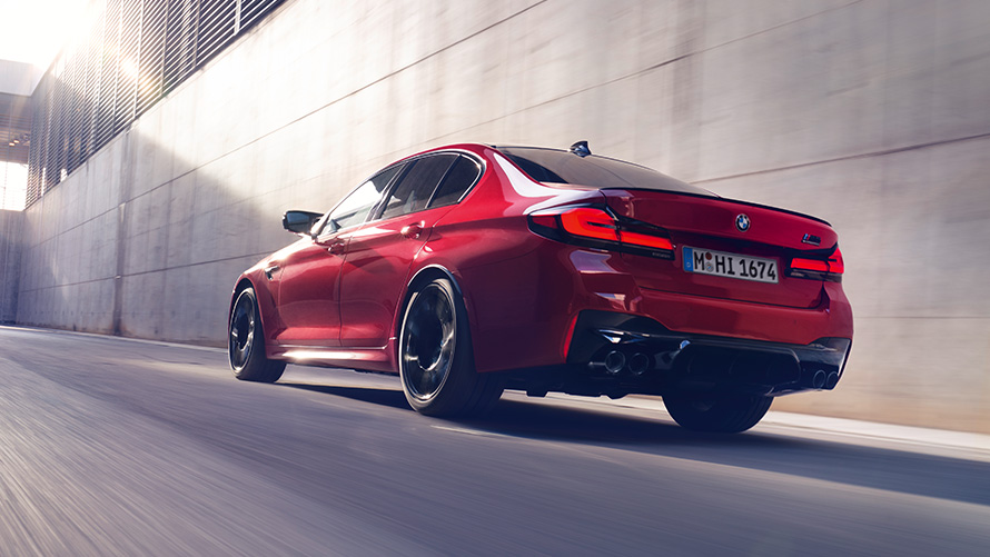 BMW M5 Competition F90 LCI Facelift 2020 BMW Individual Imola Red three-quarter rear view driving
