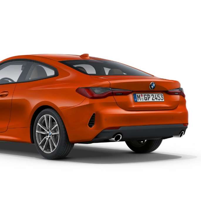 BMW 4 Series Coupé G22 2020 Basic equipment Sunset Orange metallic three-quarter rear view